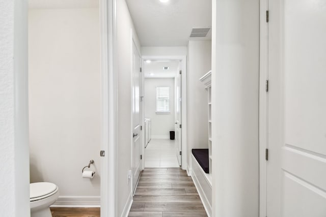 82 Lone Cypress Way, Saint Augustine, FL 32092 - hallway featuring wood finished floors