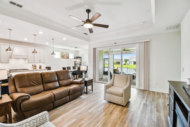 82 Lone Cypress Way, Saint Augustine, FL 32092 - living area featuring a ceiling fan, a raised ceiling, light wood-type flooring, and recessed lighting