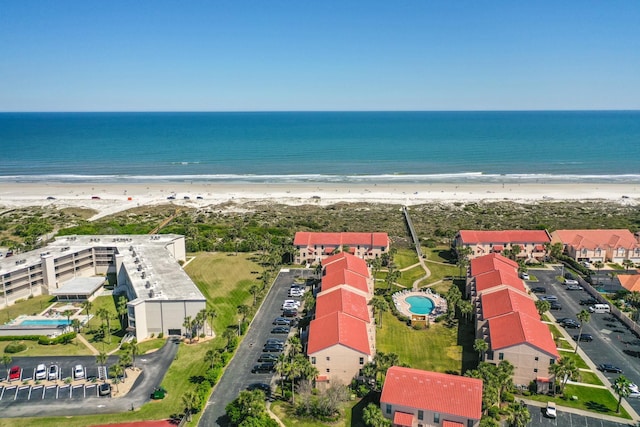 bird's eye view with a view of the beach and a water view