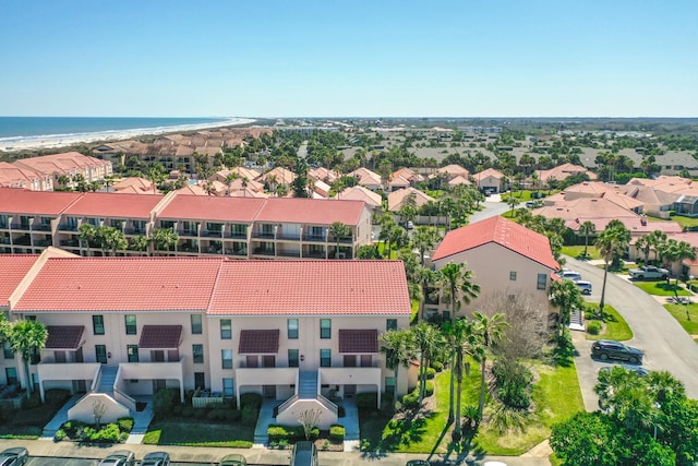 drone / aerial view with a water view and a residential view