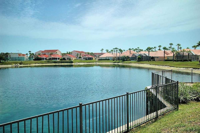 water view with a residential view and fence