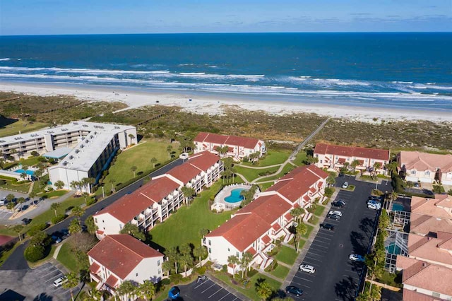 birds eye view of property with a residential view, a beach view, and a water view