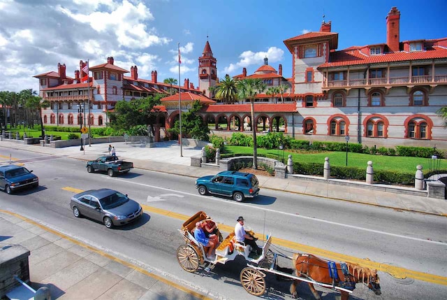 view of road with sidewalks and curbs