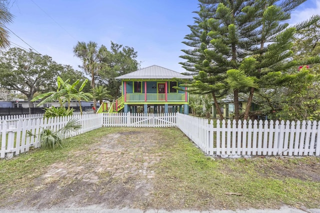 view of yard with covered porch