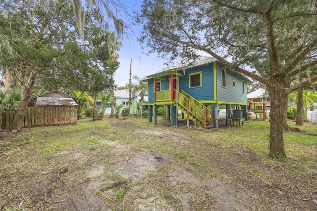 rear view of property featuring cooling unit