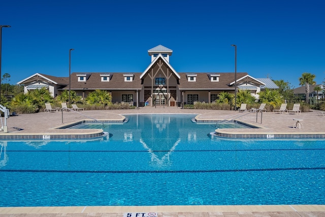 community pool featuring a patio area