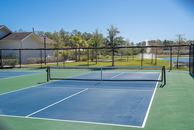 view of sport court with fence