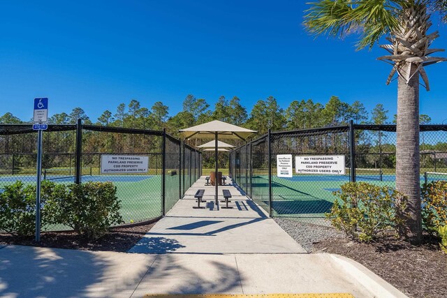 view of home's community with fence