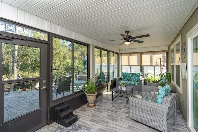 sunroom / solarium with ceiling fan