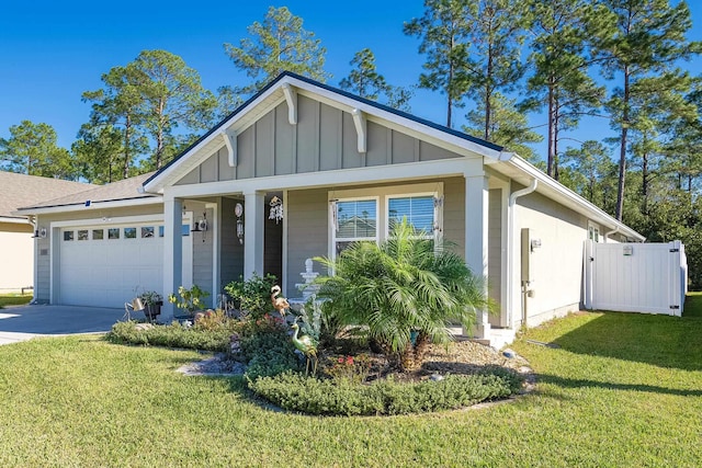 view of front of home featuring board and batten siding, an attached garage, driveway, and a front lawn