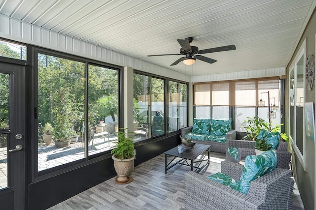 sunroom / solarium with ceiling fan