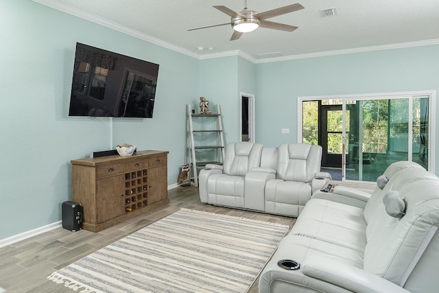 living room with crown molding, baseboards, visible vents, and wood tiled floor