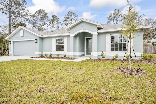 ranch-style home with a garage and a front lawn