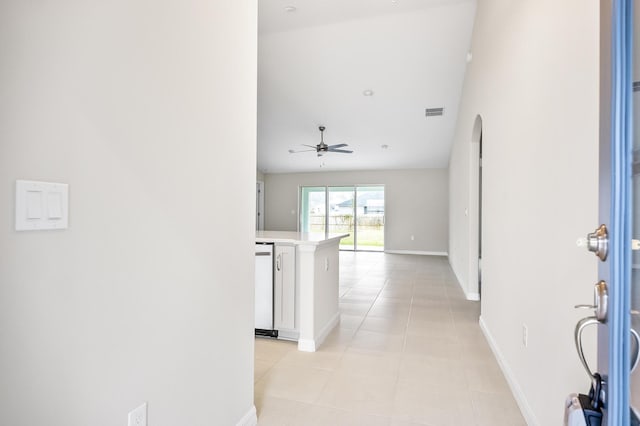 hall featuring light tile patterned floors