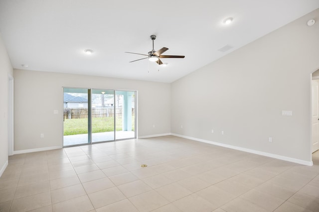 empty room with ceiling fan and light tile patterned floors