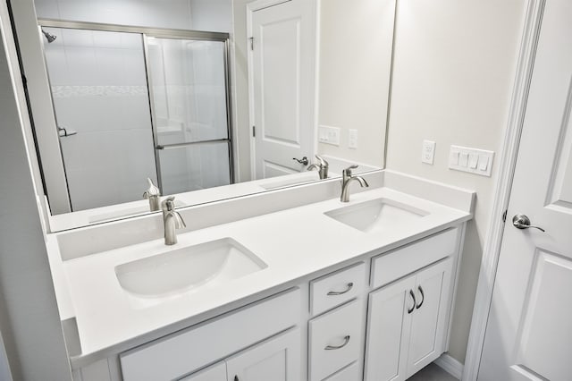 bathroom with vanity and an enclosed shower