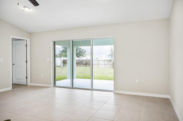 unfurnished room featuring vaulted ceiling, light tile patterned floors, and ceiling fan