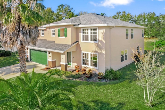 view of front facade with a front yard and a garage