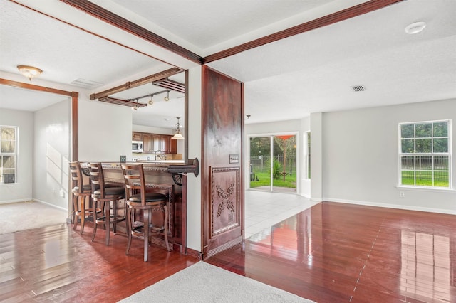 4905 Cypress Links Blvd, Elkton, FL 32033 - kitchen featuring stainless steel microwave, healthy amount of natural light, and wood finished floors