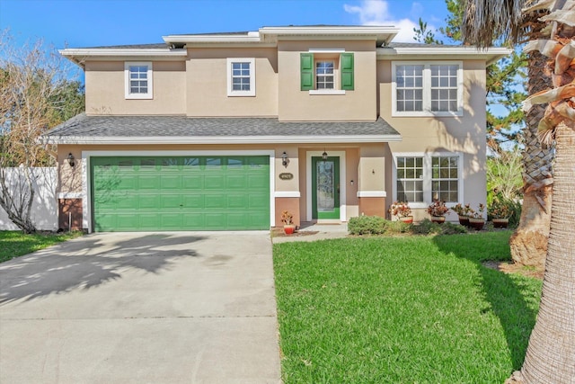 view of front facade with a front lawn and a garage