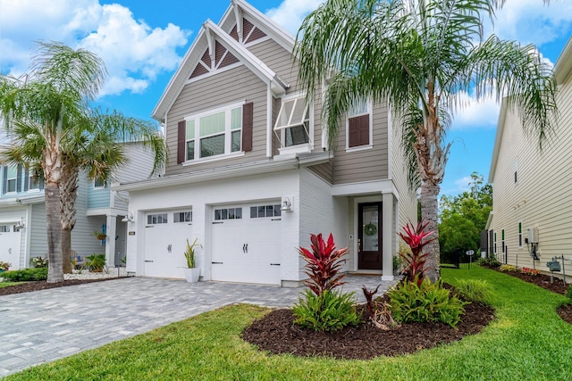 view of front facade with a garage and a front yard