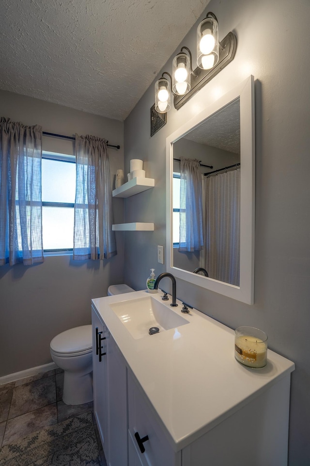 full bath with visible vents, a textured ceiling, toilet, and vanity