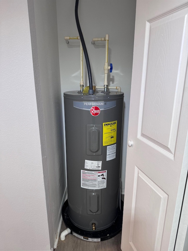 utility room featuring electric water heater