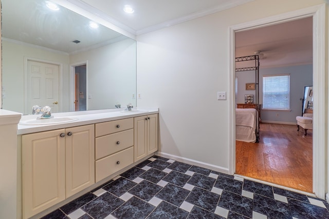 bathroom featuring vanity, wood-type flooring, and ornamental molding