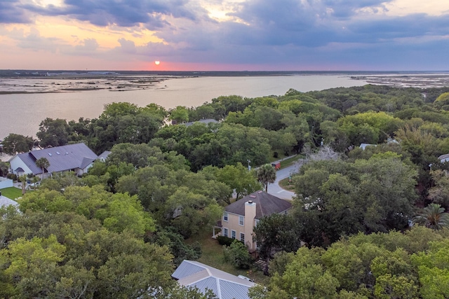 aerial view at dusk with a water view