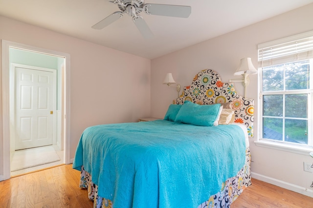 bedroom with hardwood / wood-style flooring and ceiling fan