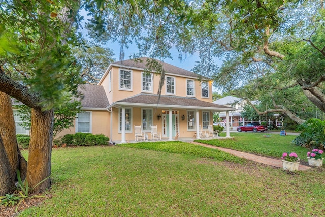 view of front of house featuring a porch and a front yard