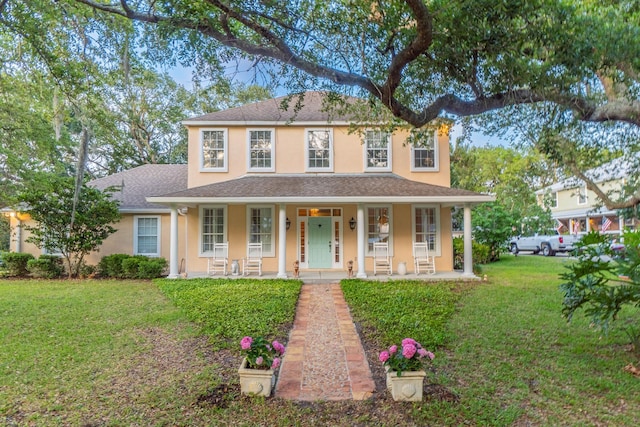 view of front of property with a front lawn and a porch