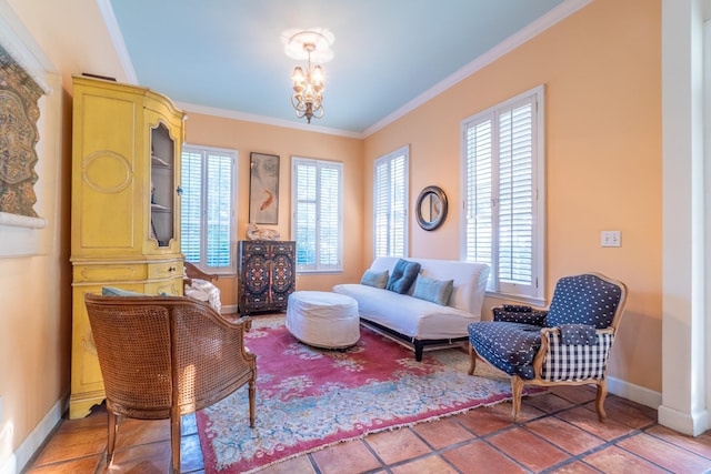 living area featuring a chandelier, ornamental molding, tile patterned floors, and a healthy amount of sunlight