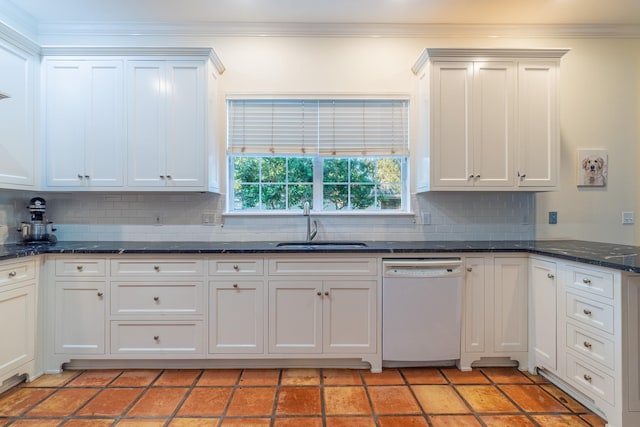 kitchen with tasteful backsplash, dishwasher, white cabinets, and sink