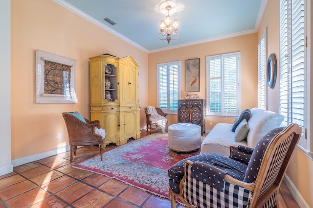 sitting room with tile patterned floors, ornamental molding, and an inviting chandelier