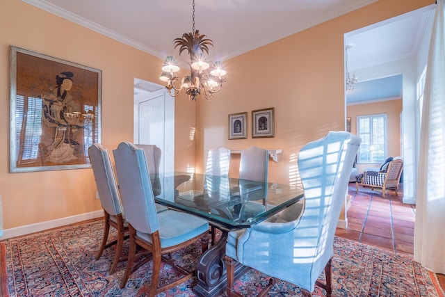 dining room featuring ornamental molding and an inviting chandelier