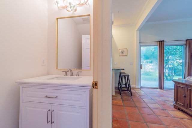 bathroom with ornamental molding and sink