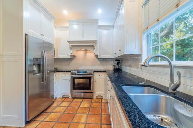 kitchen with white cabinetry, sink, and stainless steel appliances