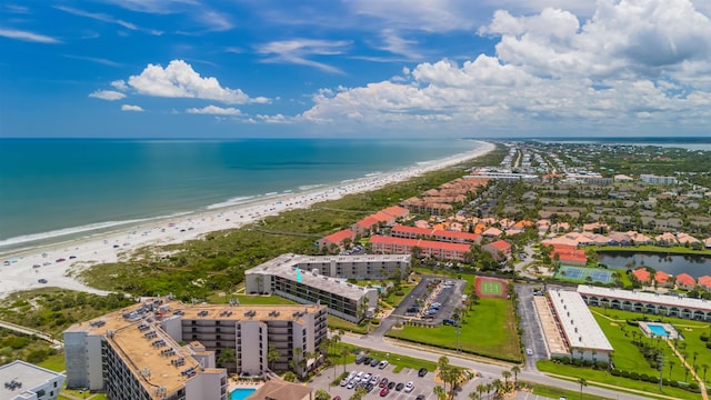 aerial view featuring a view of the beach and a water view