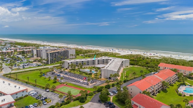 aerial view featuring a water view and a beach view
