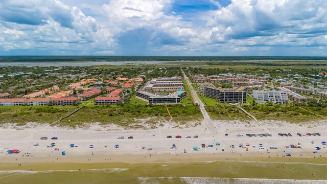 birds eye view of property with a beach view and a water view