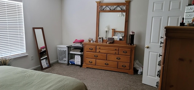 bedroom featuring dark colored carpet