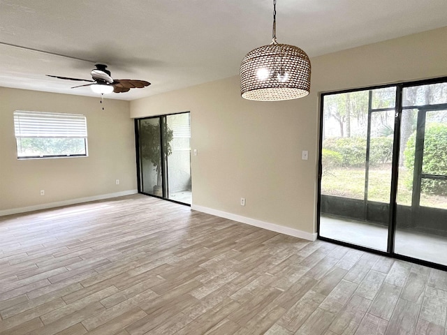 9 Alcira Ct, Saint Augustine, FL 32086 - empty room with baseboards, ceiling fan, and light wood-style flooring