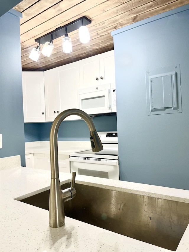 9 Alcira Ct, Saint Augustine, FL 32086 - kitchen with white appliances, white cabinetry, light stone counters, and wooden ceiling