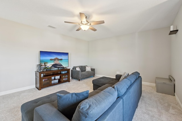 living room with light carpet and ceiling fan