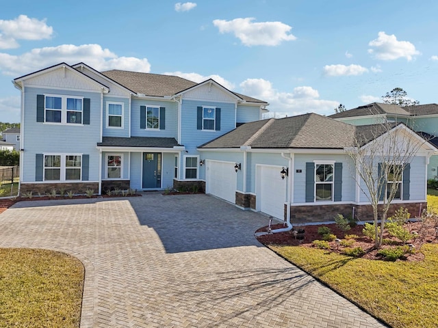 view of front facade with a garage and a front lawn