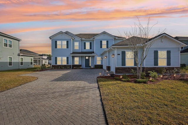 front facade with a yard