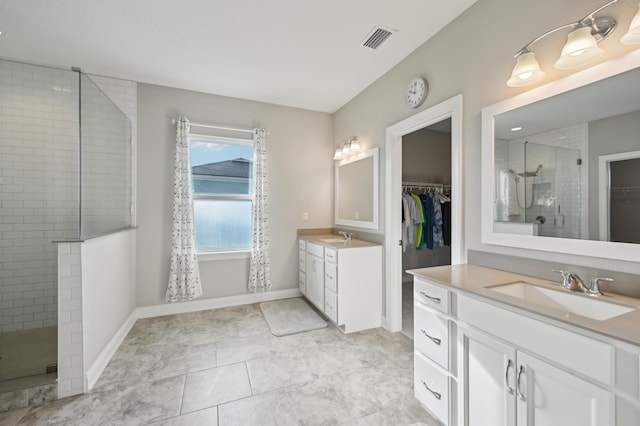 bathroom with vanity and an enclosed shower