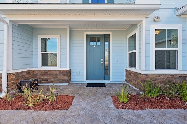 doorway to property with a porch