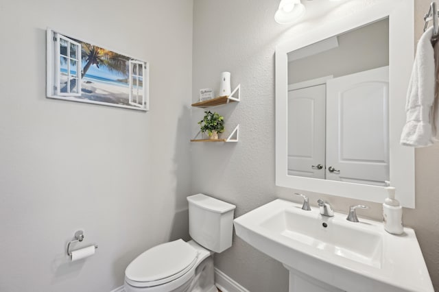 bathroom with sink and toilet